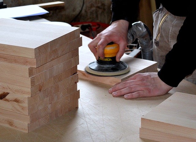 carpenter-sanding wood board
