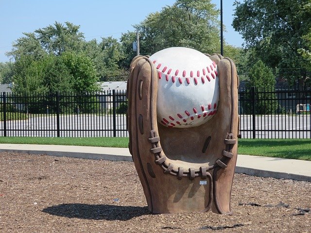 catchy business name idea featured statue of a baseball mit catching a baseball